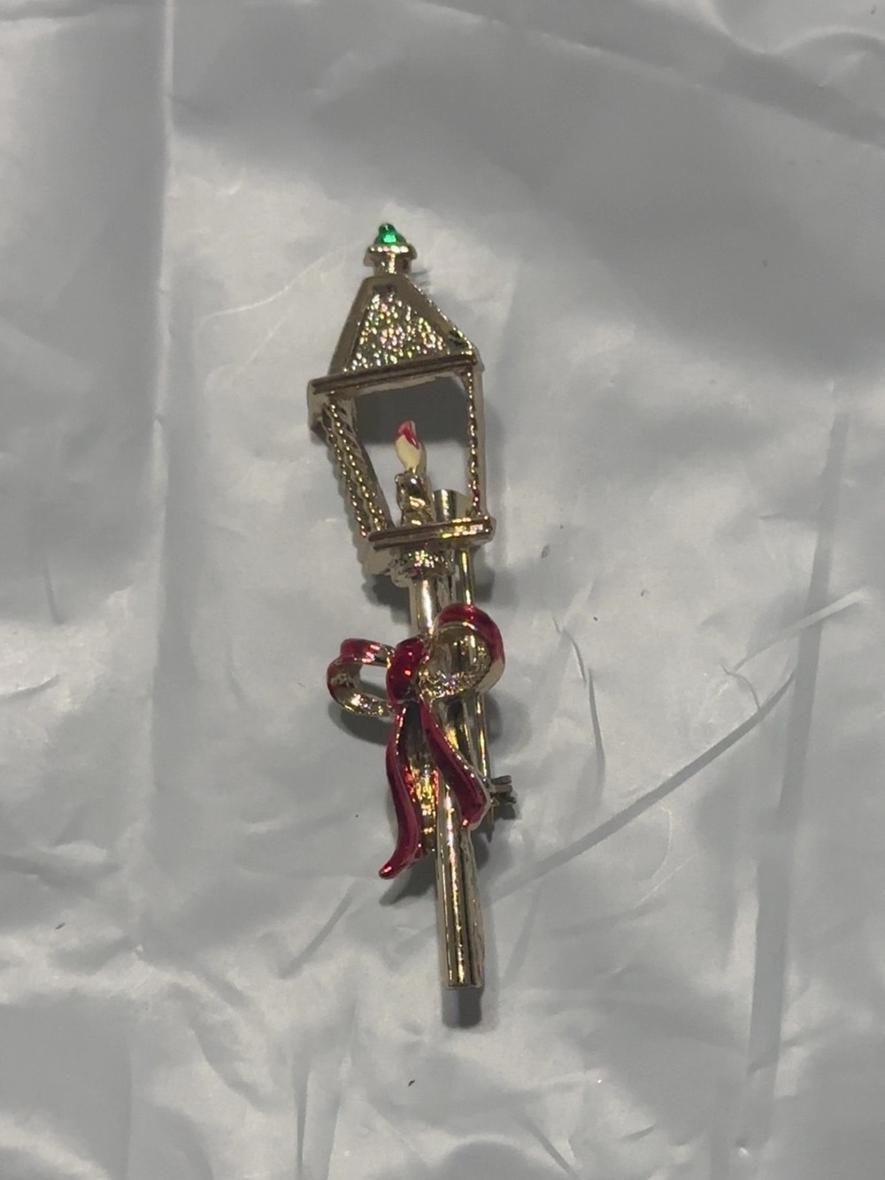 Gold Lamp Post Brooch with Red Ribbon and Emerald Accent